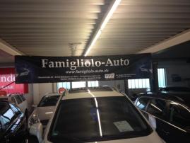 Exclusives Werbebanner von der GGG an " Famigliolo-Auto " in Mühlheim am Main